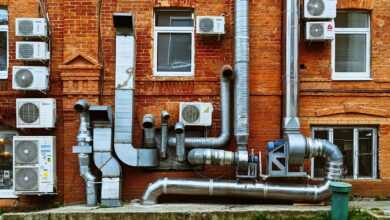 a building with a bunch of pipes on the side of it