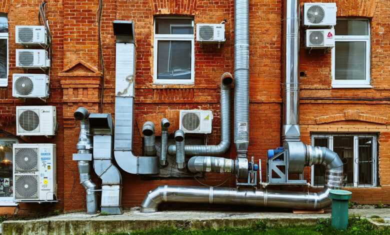 a building with a bunch of pipes on the side of it