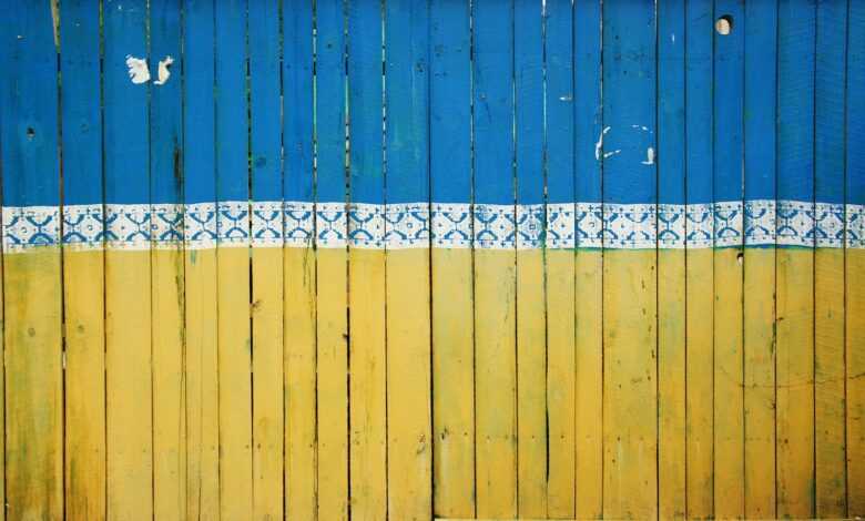 yellow and blue wooden fence