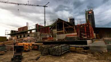 a construction site with a crane in the background