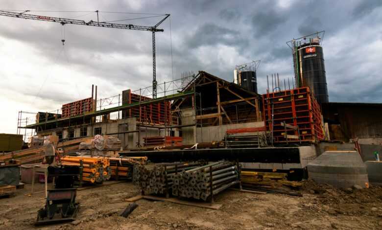 a construction site with a crane in the background