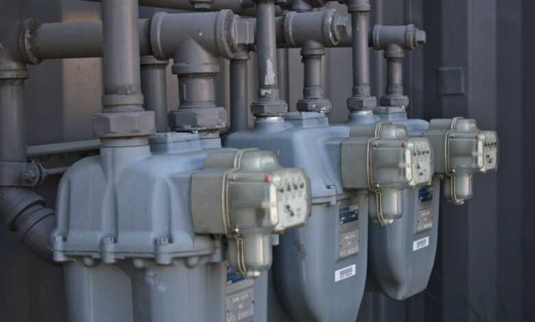 a row of water pumps sitting next to each other