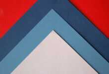 a close up of three different colors of paper
