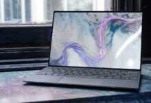 laptop on brown wooden table